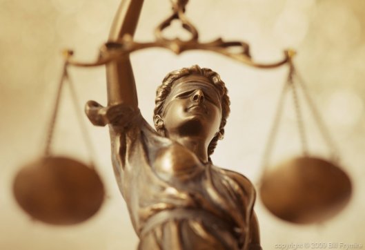 Lady Justice holding her iconic scales. http://cmsny.org/wp-content/uploads/lady-liberty-scales-of-justice-h-1000.jpg