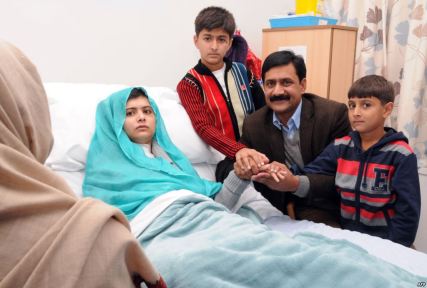 Malala and her family during her recovery. Her mother, who prefers to not be photographed can be seen from behind on the bottom left corner.
